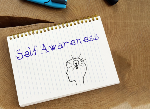 "Self-Awareness" text written on the notebook